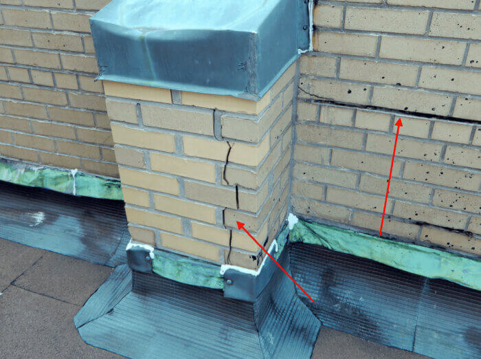 DOB inspectors found cracks at in the parapet at the top of the building. 