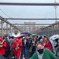 Tenants and housing advocates march over the Brooklyn Bridge to protest high rents.