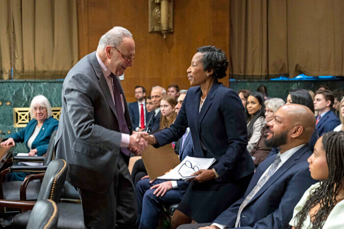 Senate Majority Leader Charles "Chuck" Schumer greets and congratulates Jamaican-American Orelia Merchant on her new appointment as a district judge on the United States District Court for the Eastern District of New York (EDNY).