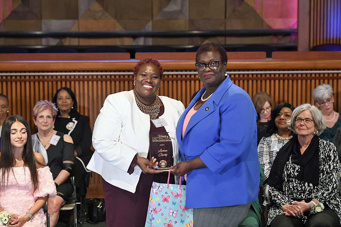 Sen. Roxanne J. Persaud (left) presents Brooklyn’s Lucina Clarke with the NYS Senate Woman of Distinction Award.