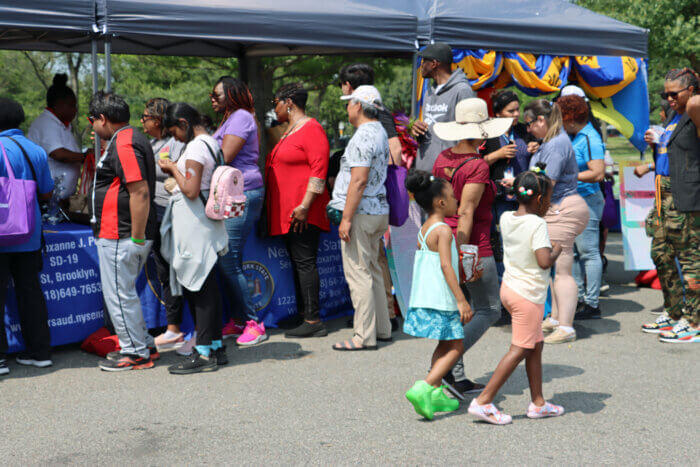 Patrons queuing for tasty Caribbean dishes.