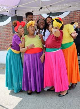 Braata Productions folks singers huddle for "Banana.”