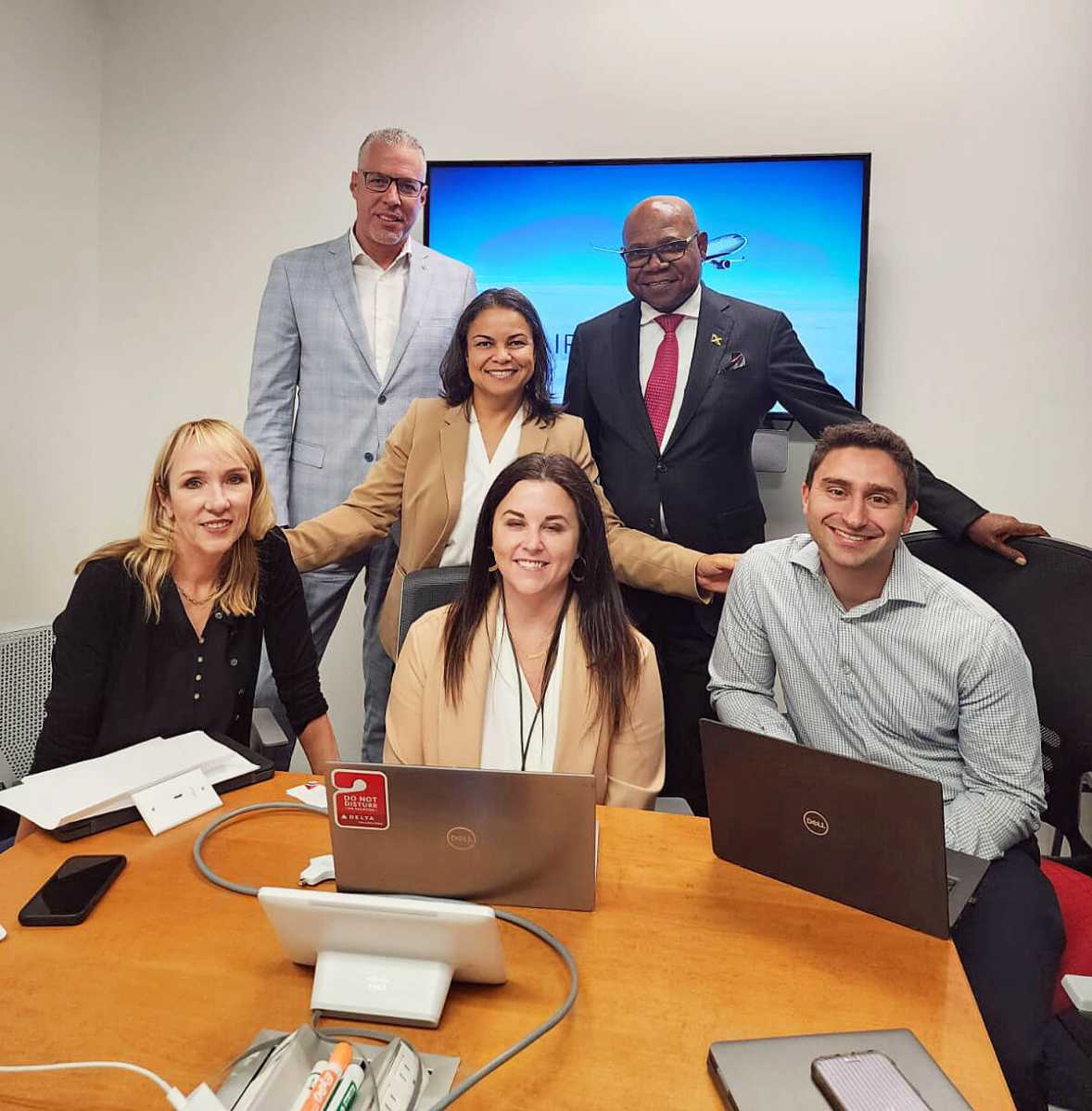 Jamaica’s Minister of Tourism, Edmund Bartlett (standing R), at the Delta Airlines headquarters in Atlanta.