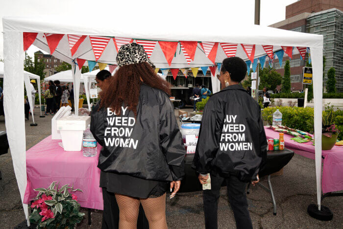 Guests in 'Buy Weed From Women" jackets.