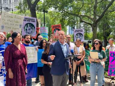 Comptroller Brad Lander addresses the rally.
