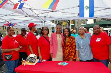 Volunteers of the WIADCA join Assemblywoman Monique Chandler-Waterman, fifth from left, Congresswoman Yvette D. Clarke and WIADCA Chair Michelle Gibbs, extreme right to celebrate Caribbean Heritage Month on Brooklyn Borough Hall Plaza, June 24.