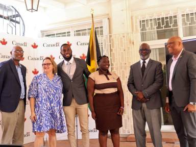 From left: Basil Rodney, father of Brendon Rodney; Canadian High Commissioner Emina Tudakovic; Canadian Olympian and Scholarship Recipient Brendon Rodney; Shantel Monroe, 2nd Year Student at GC Foster College; Denzil Thorpe, Permanent Secretary in the Ministry of Culture, Gender, Entertainment, and Sport; and Maurice Wilson, Principal of the C. Foster College of Physical Education and Sport, pose for a group photo at the launch of Rodney's Life Beyond Sports Foundation and Scholarship Awards on May 30, 2023, at the Official Residence of Canada.