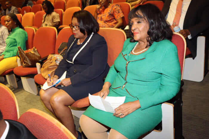 Dr. Evelyn Castro, left, and New Provost Dr. Antoinette Coleman watch Prime Minister Ralph Gonsalves' address virtually.