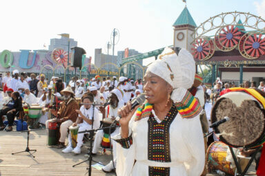 Decked out in traditional African wear, singer of the NYC Nayhabinghi ensemble paid tribute to the ancestors with moving renditions, at the 34th Annual Tribute to the Ancestors on the Coney Island boardwalk on June 10, 2023.