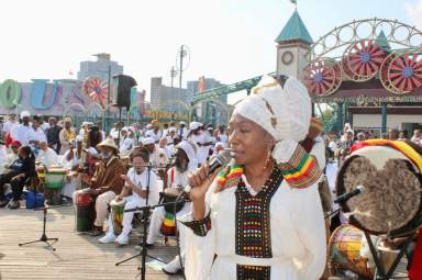 Decked out in traditional African wear, singer of the NYC Nayhabinghi ensemble paid tribute to the ancestors with moving renditions, at the 34th Annual Tribute to the Ancestors on the Coney Island boardwalk on June 10, 2023.