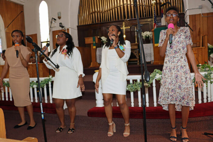 UVOP young adults offer the African version of "I Lift My Hand in Praise.” 