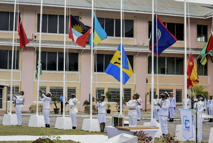 Members of the Trinidad and Tobago Defence Force raise the flags of CARICOM nations during a flag raising ceremony at the Convention Centre in Chaguaramas, Trinidad and Tobago, Tuesday, July 4, 2023. Tuesday marks the 50th Anniversary of the signing of the Treaty of Chaguaramas, which established the Caribbean Community, CARICOM.