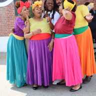Braata Folk Singers huddle for "Banana" during the 3rd Caribbean Heritage, Juneteenth Festival in June at Seaview Park in Canarsie, Brooklyn.