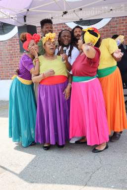 Braata Folk Singers huddle for "Banana" during the 3rd Caribbean Heritage, Juneteenth Festival in June at Seaview Park in Canarsie, Brooklyn.