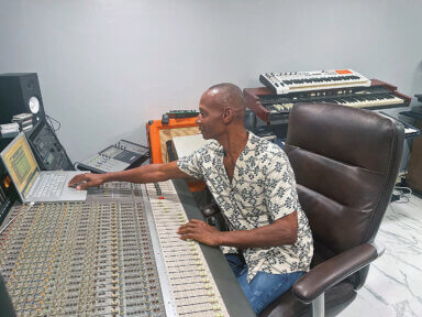 Vincentian musician Joe Alert at work in his home studio.