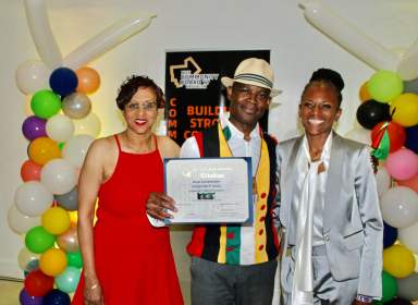 From left, June Persaud Chairperson of Community Board 17 Commerce Committee, Guyanese born award-winning, singer, songwriter Courtney Noel who was presented with a citation from Assemblywoman Monique Chandler-Waterman, Assembly District 58, right, at a Caribbean Heritage Wine & Food presentation at J-Loft, on June 27.