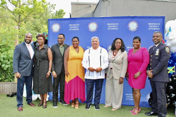 Honorees from left, Omar and Lorna Hawthorne, Rev. Edward Richard Hinds, Wendy Jules, Brooklyn District Attorney Eric Gonzalez, Judge Sylvia Hinds-Radix, Carla Nelson, and Inspector Gaby Celiba, at the Brooklyn Children's Museum during the first Caribbean American Heritage event hosted by the office of the Brooklyn District Attorney, on June 29.