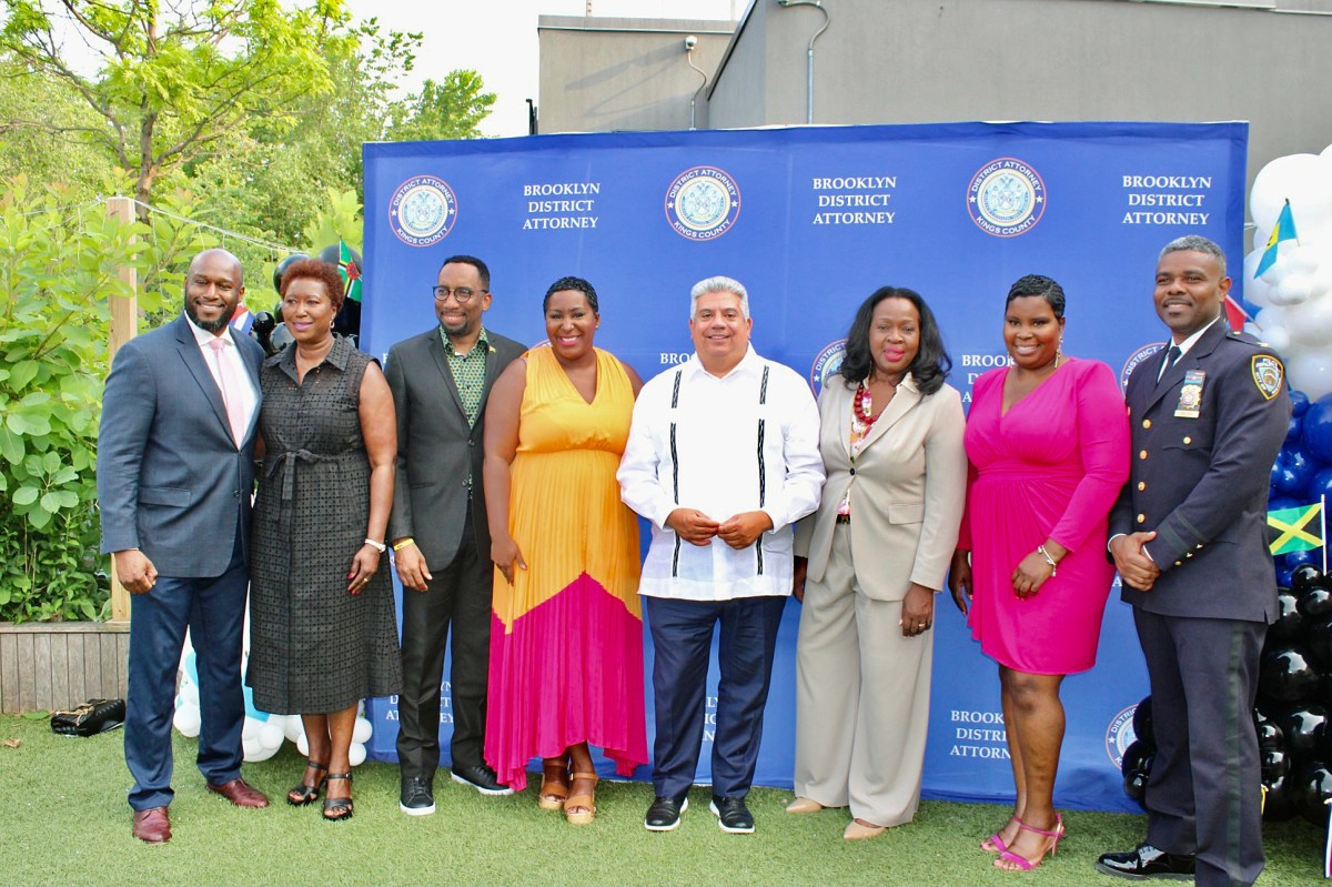 Honorees from left, Omar and Lorna Hawthorne, Rev. Edward Richard Hinds, Wendy Jules, Brooklyn District Attorney Eric Gonzalez, Judge Sylvia Hinds-Radix, Carla Nelson, and Inspector Gaby Celiba, at the Brooklyn Children's Museum during the first Caribbean American Heritage event hosted by the office of the Brooklyn District Attorney, on June 29.