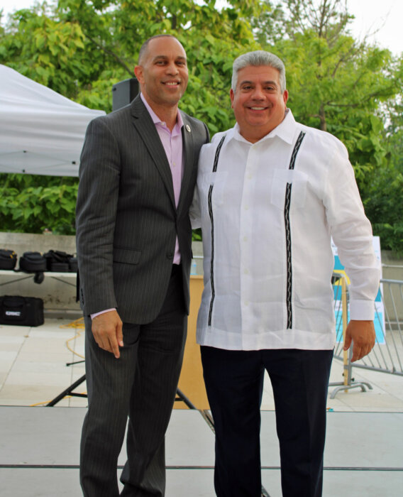 Democratic Minority Leader Hakeem Jeffries greets Brooklyn DA Eric Gonzalez on stage during the first Caribbean American Heritage event, on June 29, hosted by the office of the Brooklyn District Attorney, and held at the Brooklyn Children's Museum.