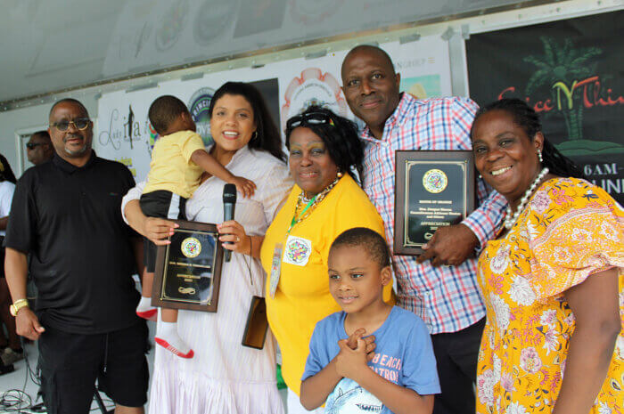 From left, Councilmember-At-Large Weldon M. Montague III, Assemblywoman Britnee Timberlake, soon to be youngest Senator in Orange, NJ, President of the Family Fun Day Committee, Lady Ira Lewis, Mayor of The City of Orange Township Dwayne D. Warren, Councilmember-At-Large Adrienne Wooten, and children of Assemblywoman Timberlake on stage, after an awards presentation at the Annual Family Fun day at Monte Erving Park, Orange County, NJ.