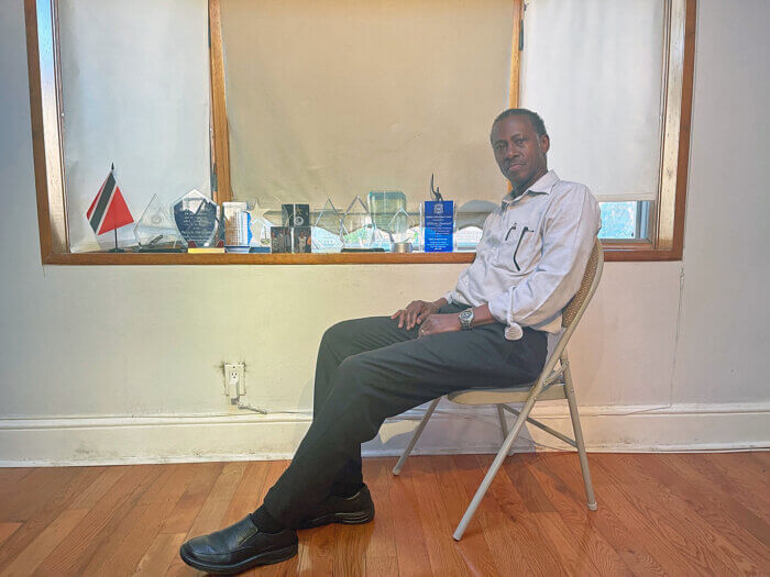 Hilton Samuel in his den with only a few of the awards he has won throughout his career.