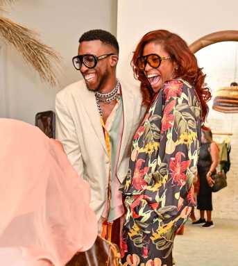 Fe Noel posed with guests after making her opening remarks at the opening of her new business.