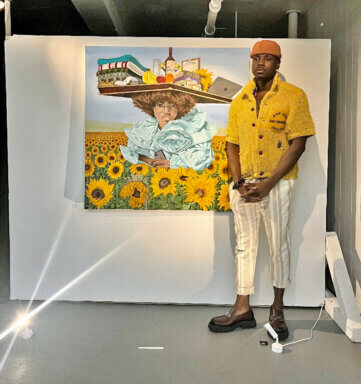 The artist Watson Mere standing next to the piece that is inspired by his great aunt.
