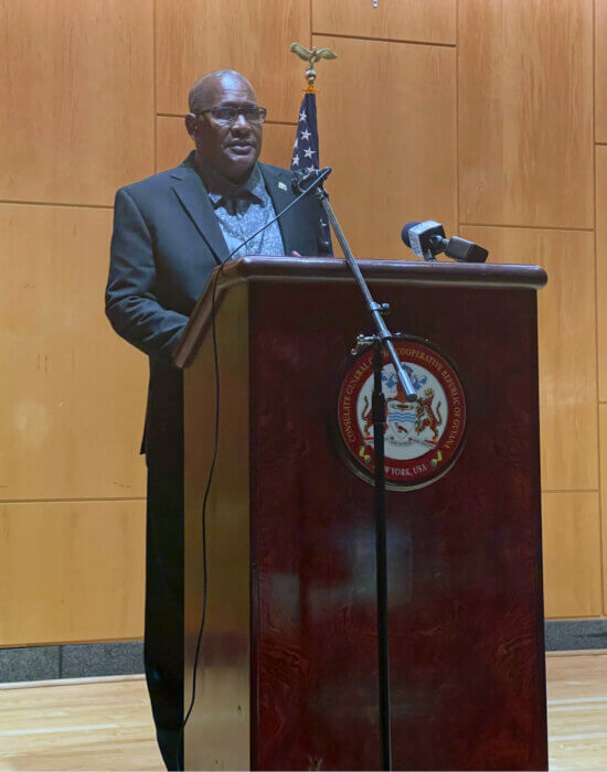 Ambassador Michael E. Brotherson delivering opening remarks to the crowd.
