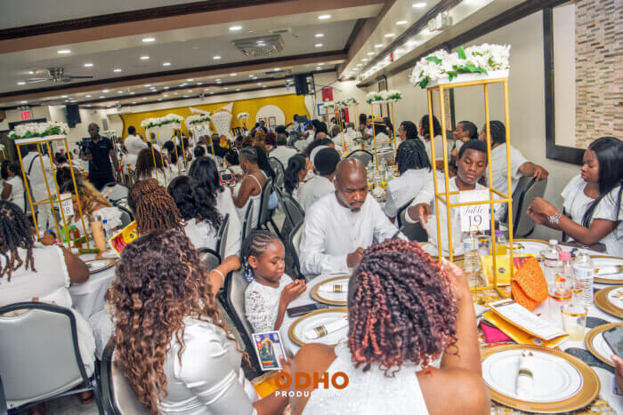 Attendees sitting at their table during the "I Rise Conference.”