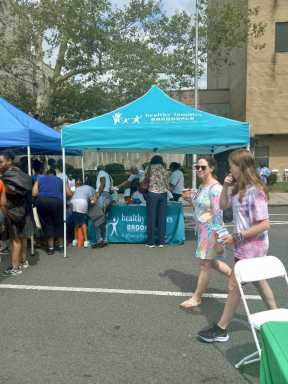 Patrons at the Brookdale Health Fair signing up for health activities.