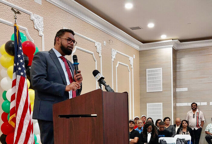 President Mohamed Irfaan Ali addresses nationals at a diaspora Town Hall meeting at the Hotel Liberty Inn & Suites in Queens.