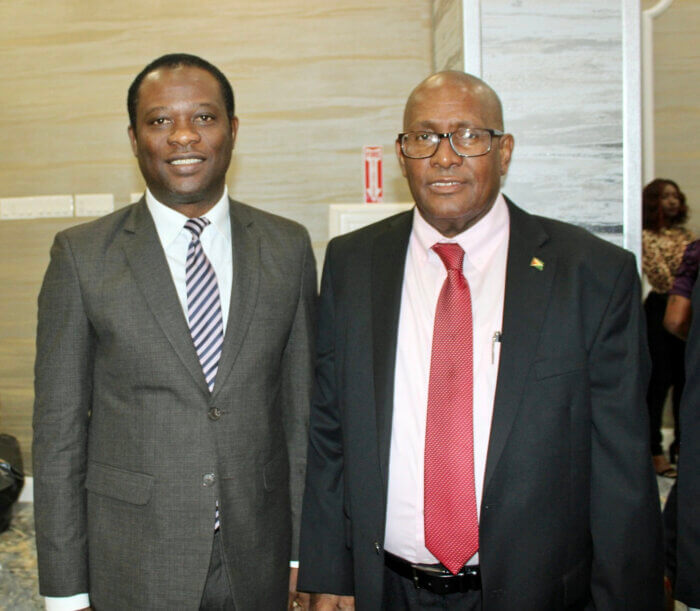 Minister of Foreign Affairs and International Cooperation Hugh Todd, left, and Consul General to New York, Michael E. Brotherson pause for a photo during President Ali's town hall meeting at the Hotel Liberty Inn & Suites in Queens.