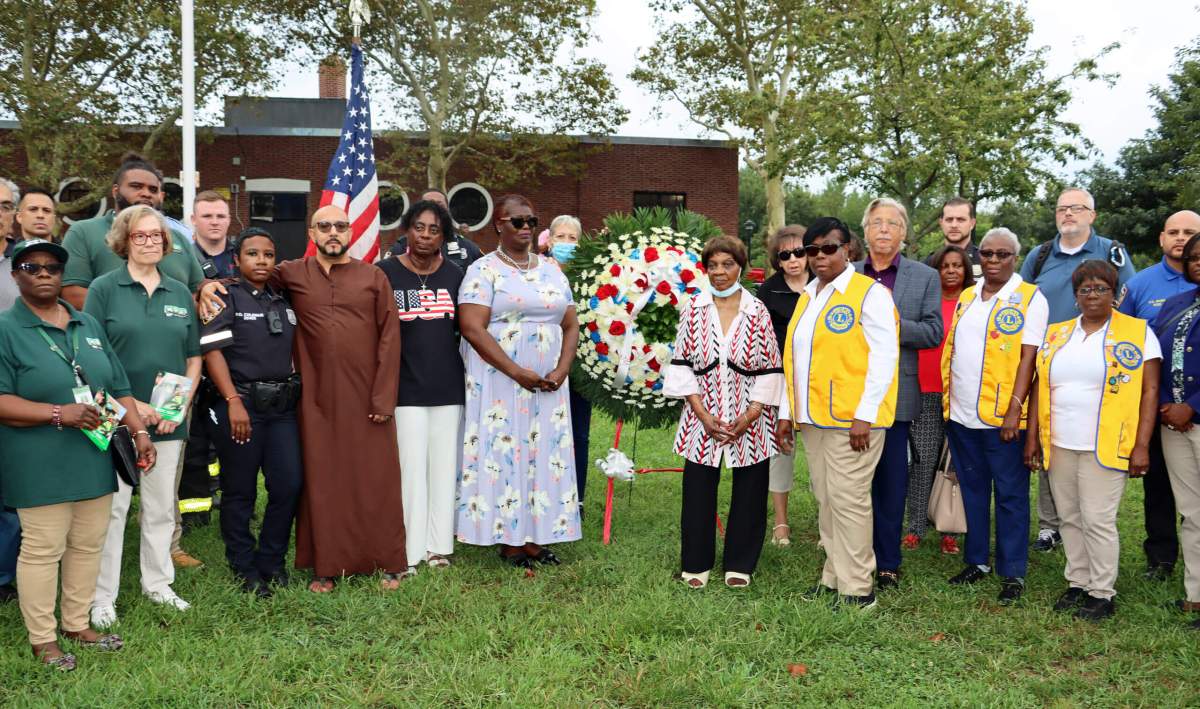 Jean Joseph, president of Brooklyn Canarsie Lions Club, eighth from left, with Lions vest, among celebrants at the 9/11 commemoration at Canarsie Park.