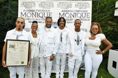 Assemblywoman Monique Chandler-Waterman, with honorees Busta Rhymes, his sons, and Dr. Meda Leacock.