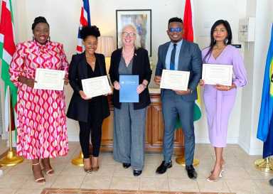 Ambassador Jane Miller, third from left, pose with Chevening Scholars, Deanna Walcott, Keisha Edwards, Joshua Floyd Benn, and Amrita Naraine.