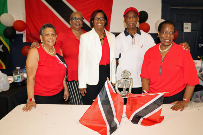 Trinidad and Tobago nationals at their table.
