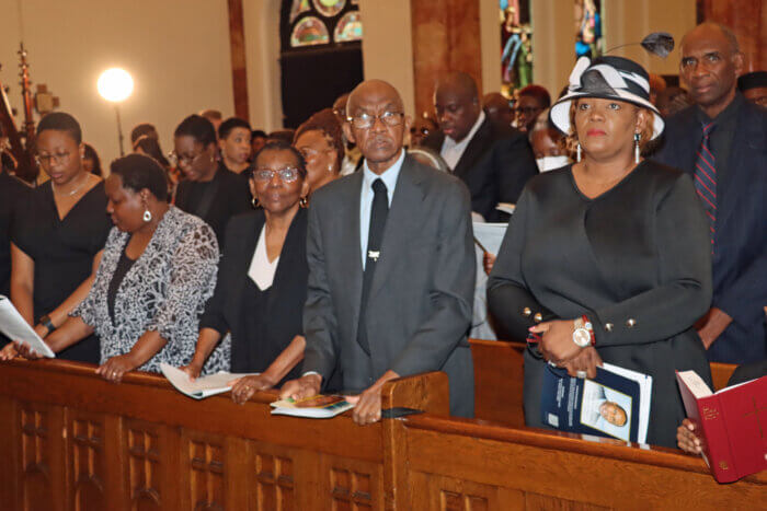 Uncle Joel Toney, former Ambassador to the UN, with his wife, Dr. Joyce Toney, third from left, in front pew.