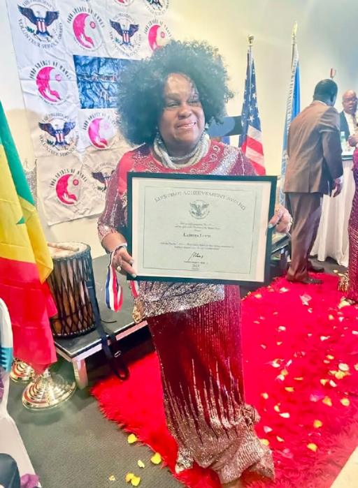 Lady Ira Lewis proudly displays her Global Peace Ambassador certificate from the Institute of Public Policy and Diplomacy Research, at the Scandinavian House on Park Avenue in Manhattan, part of the United Nations General Assembly (UNGA) Diplomacy of Excellence initiative.