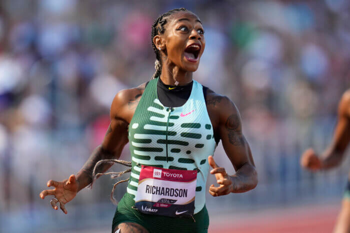 Sha'Carri Richardson reacts as she wins her heat in the first round of the women's 200 meters during the U.S. track and field championships in Eugene, Ore., Saturday, July 8, 2023.