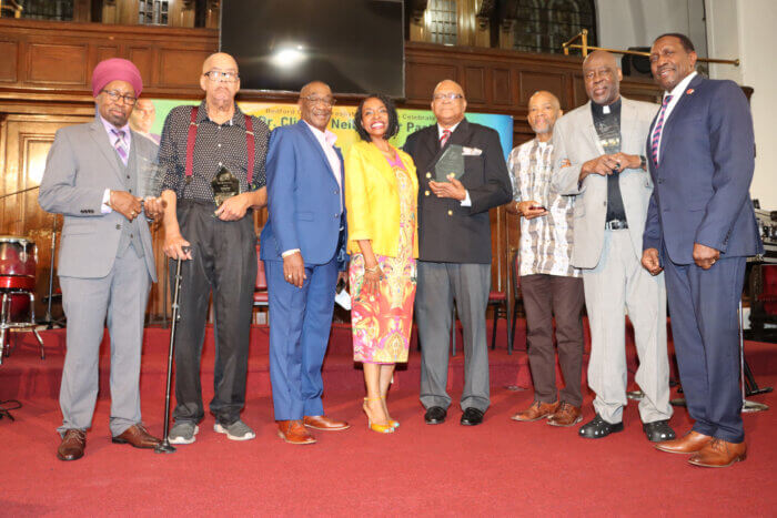 Derek Ventour, third from left, with Congresswoman Yvette D. Clarke to his left and David Williams, owner of David Williams Funeral Services, with honorees: from left: Ajamu, Gentle Benjamin, Bishop Christopher Butler, the Rev. Wesley Daniel and Fr. Leopold Baynes.