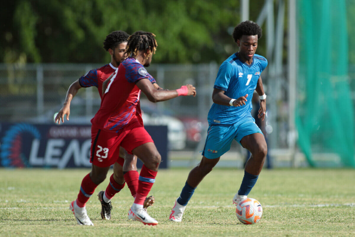 GRAND CAYMAN, CAYMAN ISLANDS. SEPT. 11: Mishawn Molina #7 of Aruba and Jabari Campbell #23 of Cayman during the League C match between Cayman Islands vs Aruba in the CONCACAF Nations League, held at the Truman Bodden Stadium, Grand Cayman, Cayman Islands.