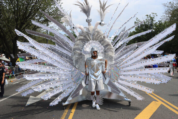 Barbadian Andre Lucas proudly wears a Sesame Flyers' costume.
