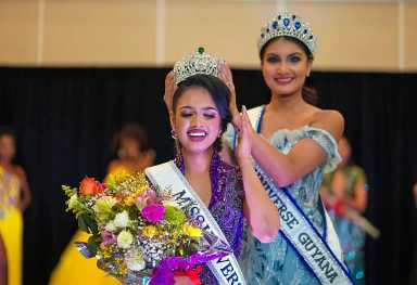Lisa Narine, Miss Guyana Universe 2023, being crowned by Miss Guyana Universe 2017, Rafieya Hussain after the pageant ceremony at the Mariott Hotel, Georgetown.