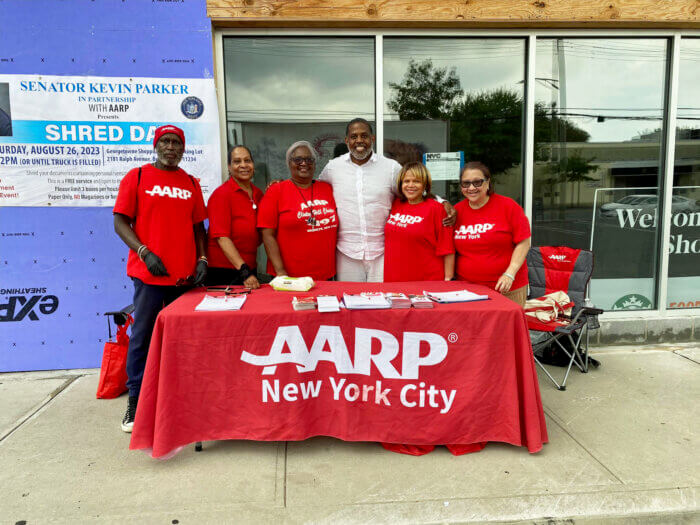 Senator Kevin Parker, center, strikes a pose with members of AARP after a successful shred day event at Gerogetowne Shopping Center in Canarsie.