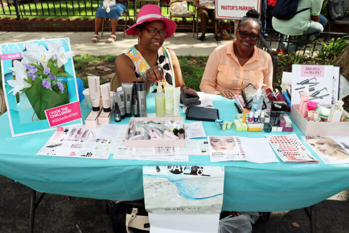 Barbadian Harriet Gooding and Jamaican Irlene Jones-Brathwaite at a Mary Kay table.