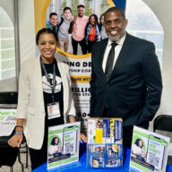 Senator Kevin Parker with an exhibitor at the Black College Expo at Medgar Evers College.