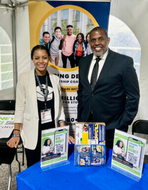 Senator Kevin Parker with an exhibitor at the Black College Expo at Medgar Evers College.
