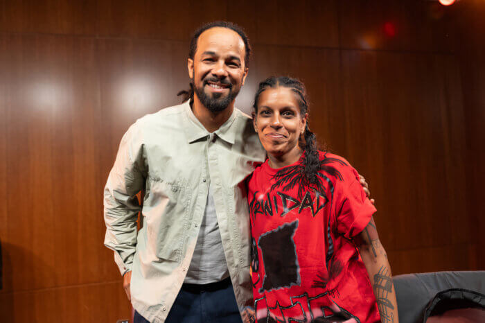 Kes poses with one of his fans who is deaf.