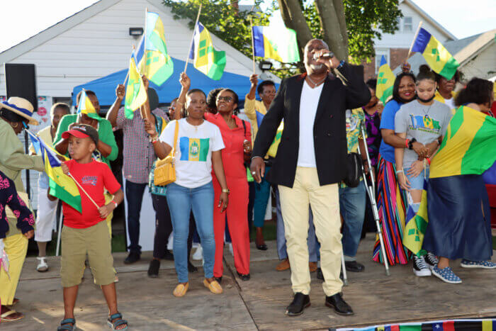 Delano "Detta" Joseph leads Vincentians in displaying national flag and singing Winston Soso's "Big Bottom.”