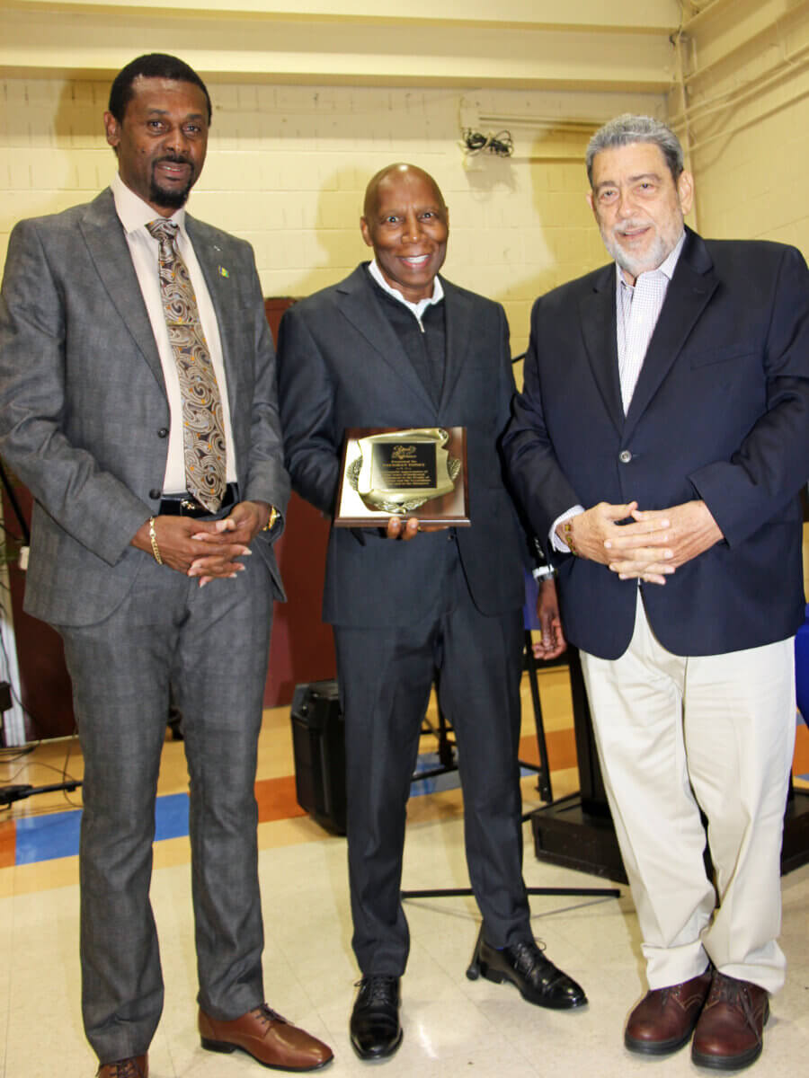 The late Vaughan Toney seen here receiving a plaque after SVG PM Dr. Ralph Gonsalves, right, announced Toney's appointment as Ambassador-at-Large in September 2022. Consul General Rondy "Luta" McIntosh is also in photo.